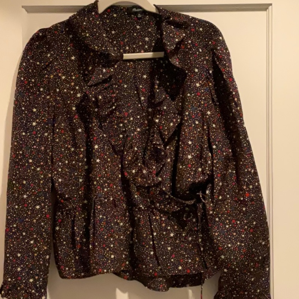 Silky black wrap around blouse with stars and ruffles and tie waist